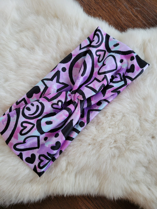 Black doodles on purple tie dye